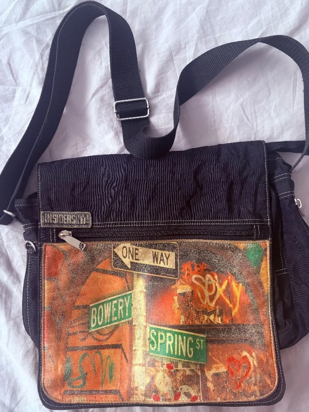 Inside NY unisex messenger bag.
